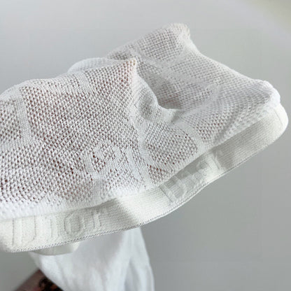 CD fishnet stockings with big D letter